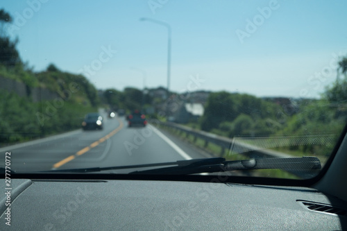 From dashboard, blurred road dashboard in focus
