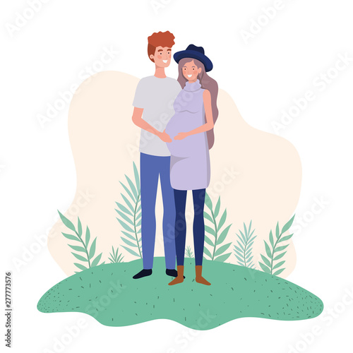 pregnant woman with husband standing in landscape