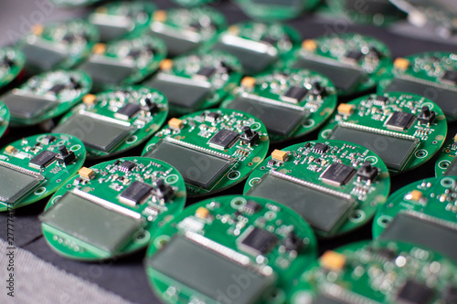 round electronic boards with display, microchip and processor, many meter components photo