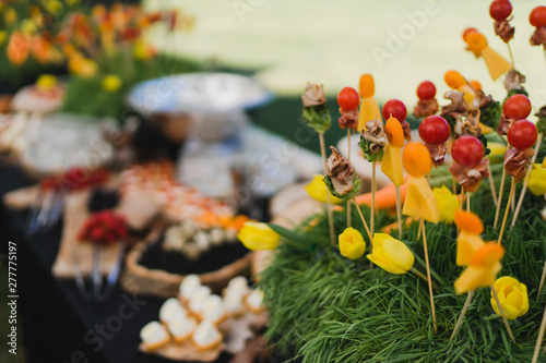 Catering banquet table at reception. Restaurant presentation, european cuisine, food consumption, party concept. Food styling, appetizers bar, welcome drink, event design.