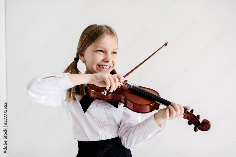 Happy girl playing violin Happy girl playing violin