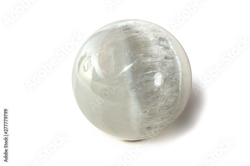 Beautiful white selenite sphere, cut mineral on white background, isolated photo