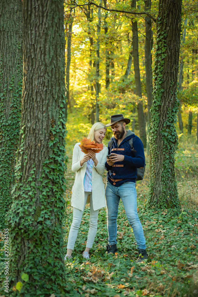 Outdoor autumn portrait Gorgeous couple models with sunny day light. Portrait of beautiful woman and man walking outdoors. Sensual couple enjoying intimacy. Outdoor autumn portrait Gorgeous couple models with sunny day light. Portrait of beautiful woman and man walking outdoors. Sensual couple enjoying intimacy.