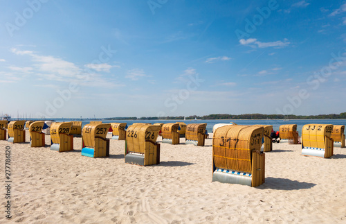 Beach with hooded beach chairs, Baltic sea seaside resort Laboe, East bank, Kieler Foerde, Schleswig-Holstein, Germany photo