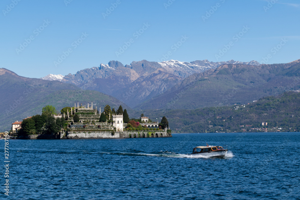 Panoramic view of boat and island in Northern Italy lakes area