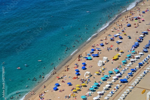 a picturesque beach view with a bird's eye view full of people resting in vacation © Joanna Redesiuk