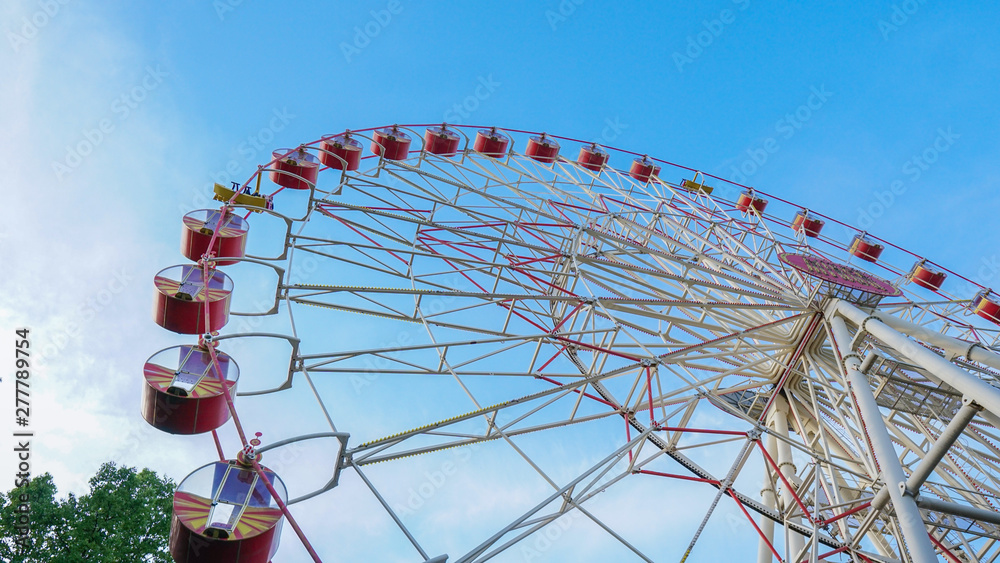Ferris Wheel Over Blue Sky.entertainment in the park