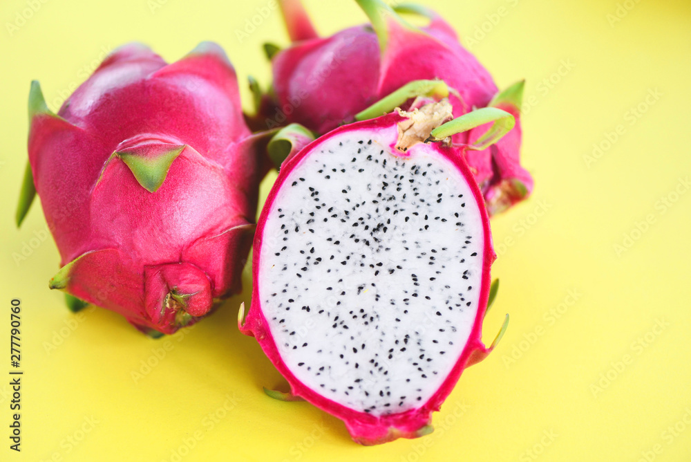 Dragon fruit slice on yellow background / Fresh pitaya summer tropical fruit Dragon fruit slice on yellow background / Fresh pitaya summer tropical fruit