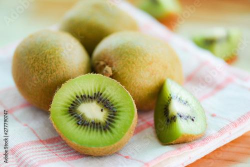 Kiwi slice on the table with kiwi fruit