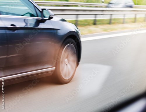 Car driving fast on highway motion blur © disq