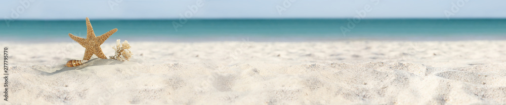 Set of different stylish beach accessories on sand. Space for text Set of different stylish beach accessories on sand. Space for text