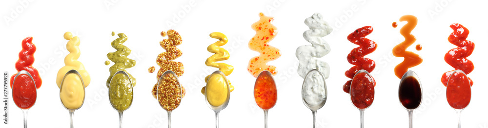 Set of spoons with different delicious sauces on white background, top view Set of spoons with different delicious sauces on white background, top view