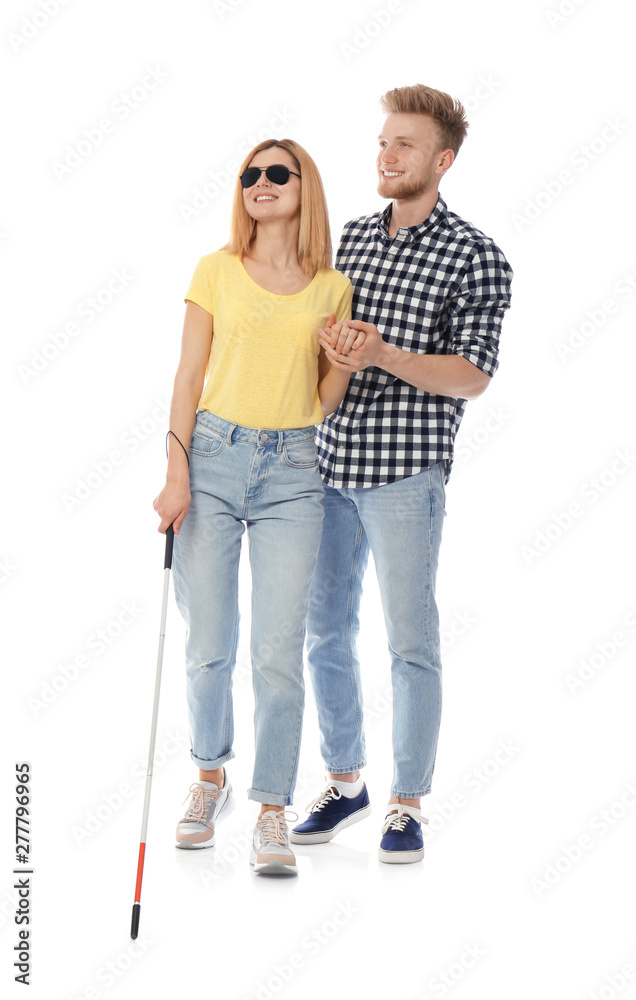 Young man helping blind person with long cane on white background Young man helping blind person with long cane on white background