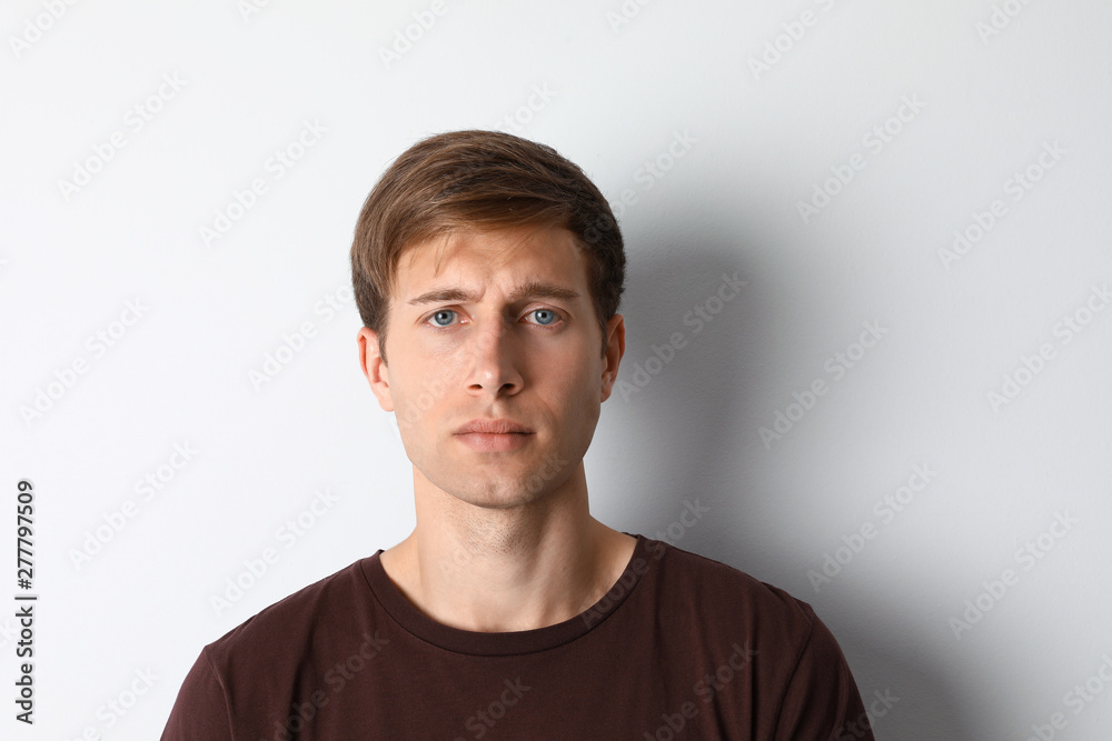 Portrait of handsome man on light background Portrait of handsome man on light background