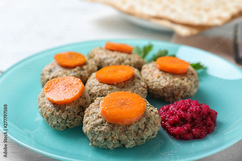 Plate of traditional Passover (Pesach) gefilte fish on table, closeup Plate of traditional Passover (Pesach) gefilte fish on table, closeup