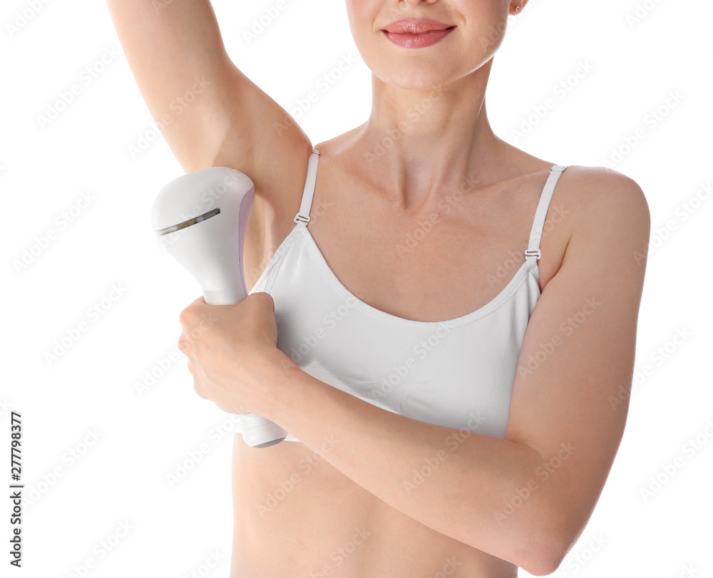 Young woman doing armpit epilation procedure on white background, closeup Young woman doing armpit epilation procedure on white background, closeup