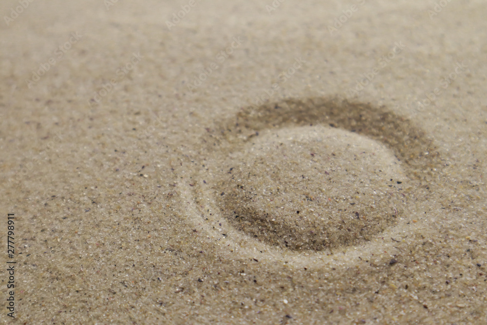 Patterns drawn on yellow sand Patterns drawn on yellow sand