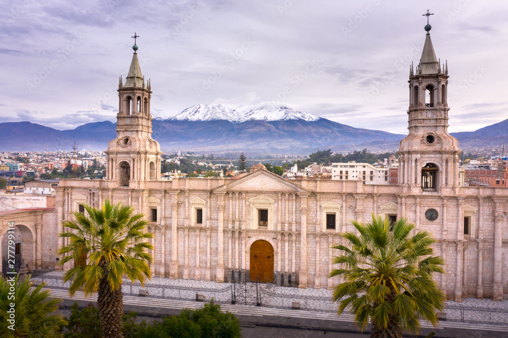 Aerial drone view of Arequipa main square and cathedral church, with the Misti volcano as background.