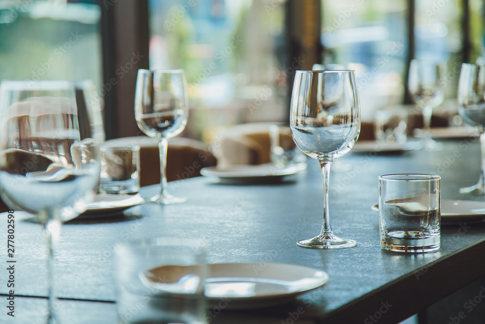 Glass goblets on the table. Served table. Table setting Glass goblets on the table. Served table. Table setting