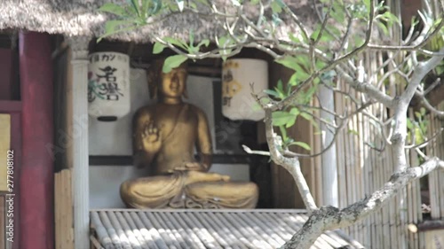 Buddha statue unfocus to focus photo
