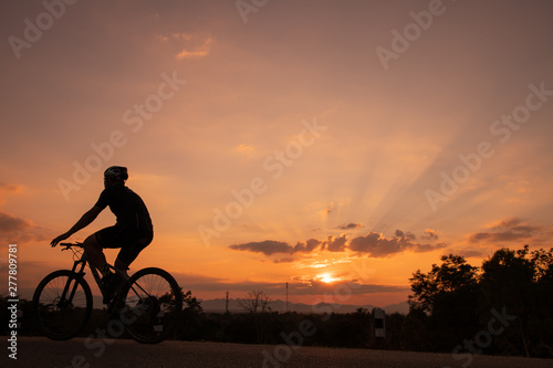 biker in sunset, copy space.