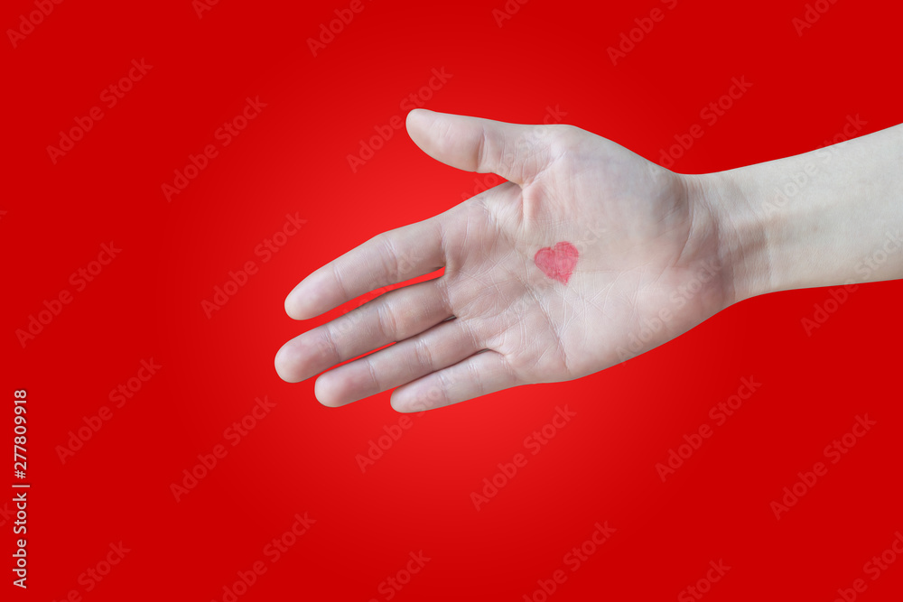 human hand hold handshake with red heart shape sign on isolated red background. human hand hold handshake with red heart shape sign on isolated red background.