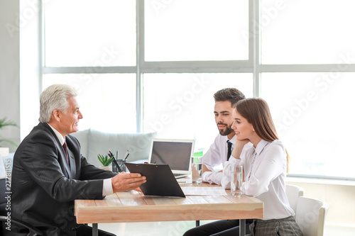 Couple meeting with notary ...