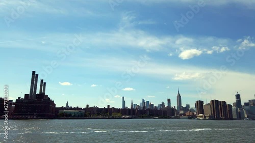 View of Manhattan skyline from ferry on East River NYC.
