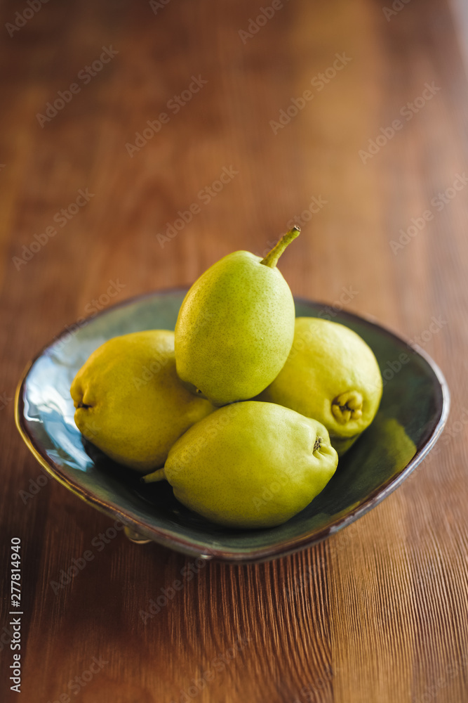 Healthy Organic Pears in plate on wooden table. Healthy Organic Pears in plate on wooden table.