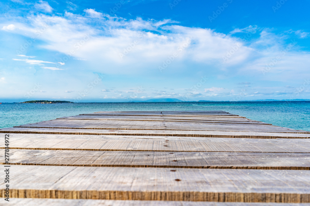 Fototapeta premium Wood Vintage Terrace on the beach with blue Sea, Ocean, Sky Background