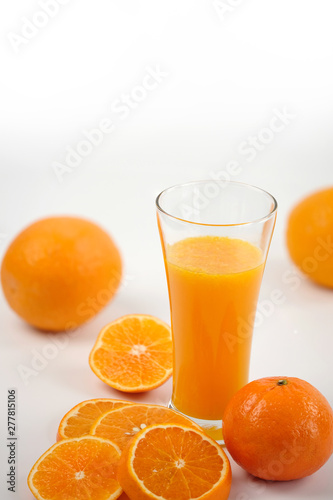 Fresh orange juice with fruits, isolated on white - Image