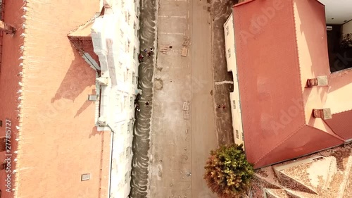 Aerial drone view of Piata Mare, the largest square in Sibiu city, in Romania. A city in Transylvania during sunset time in Europe.