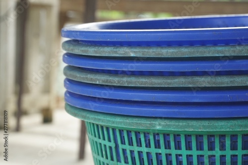 close up blue plastic basket in country farm