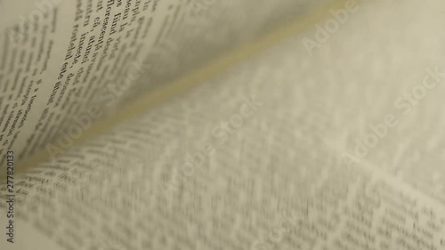 Turning book pages close up macro footage.