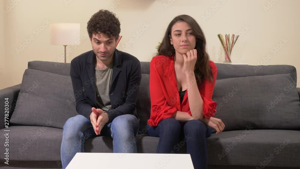 shy Couple Sitting On couch, Shy lovers At First Date, Romantic Mood