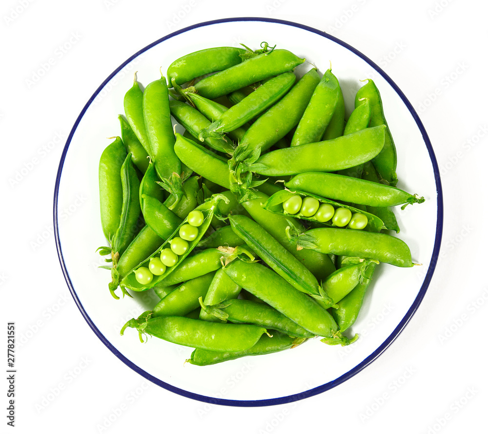 sweet peas on a metallic plate isolated sweet peas on a metallic plate isolated