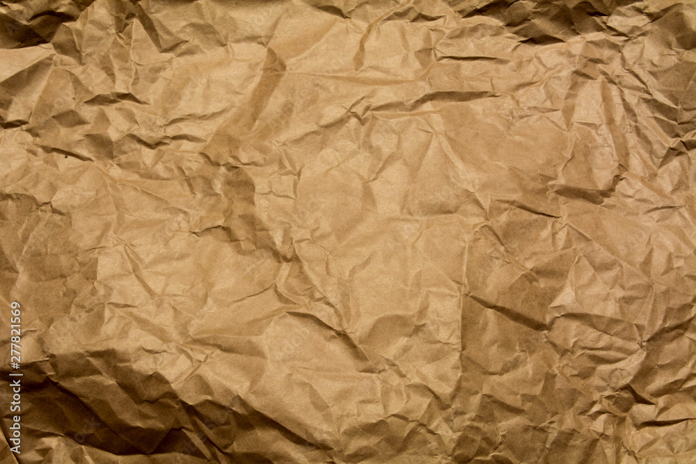 Textured crumpled sheet of Kraft paper Textured crumpled sheet of Kraft paper