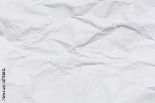 Textured crumpled sheet of white paper