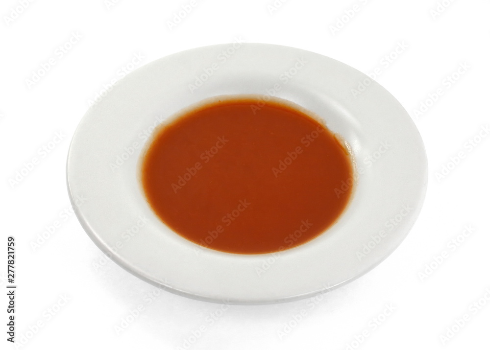 Closeup red ketchup tomato soup in a plate isolated on white background. Closeup red ketchup tomato soup in a plate isolated on white background.