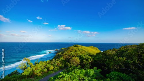 A timelapse of Miyakozaki promontory near the panoramic ocean in Amami oshima Kagoshima tilt photo