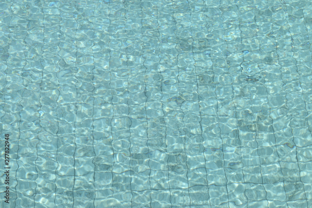 Water in the swimming pool close-up. Natural abstract background Water in the swimming pool close-up. Natural abstract background