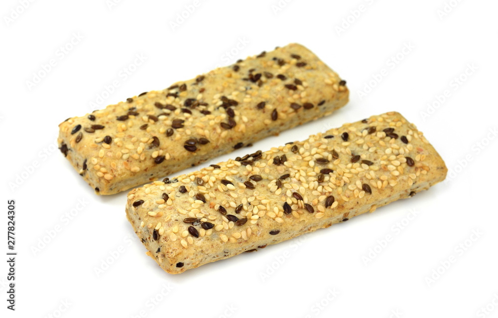 Breadsticks or grissini with sesame and linseed isolated on white background. Salt cracker isolated. Breadsticks or grissini with sesame and linseed isolated on white background. Salt cracker isolated.