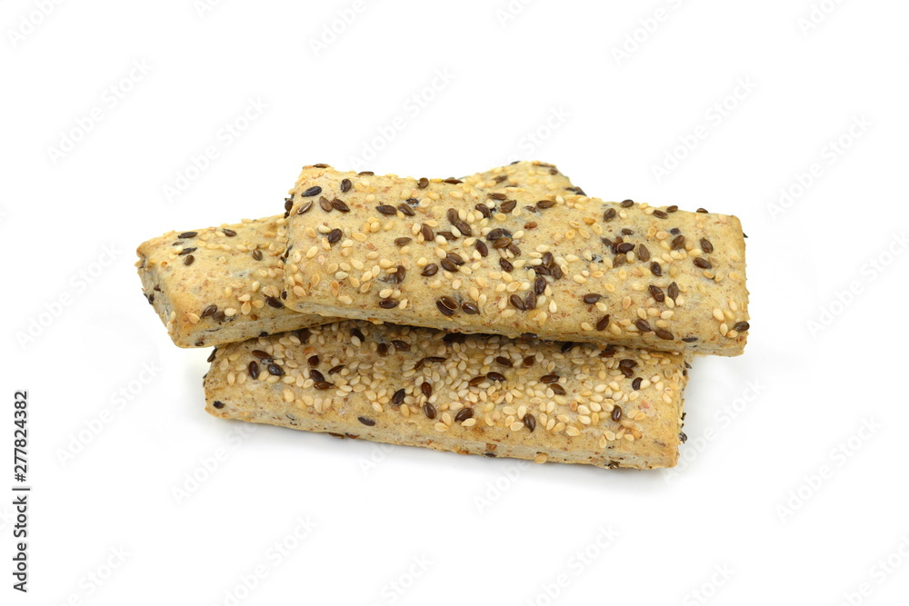 Breadsticks or grissini with sesame and linseed isolated on white background. Salt cracker isolated. Breadsticks or grissini with sesame and linseed isolated on white background. Salt cracker isolated.