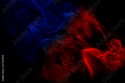 color smoke as abstract shape in the air on black background