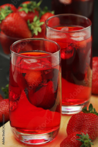 Glasses with strawberry drink with ice