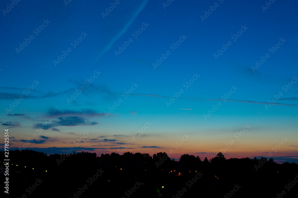 Summer Blue Hour over the Horizon of a Little European Town.