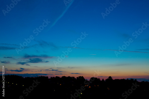 Summer Blue Hour over the Horizon of a Little European Town.