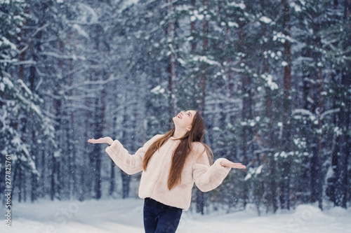 beautiful girl in winter forest