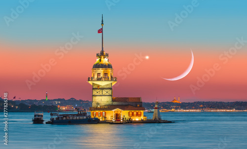 Istanbul Maiden Tower (kiz kulesi) at sunset in the background Venus and crescent (New moon)