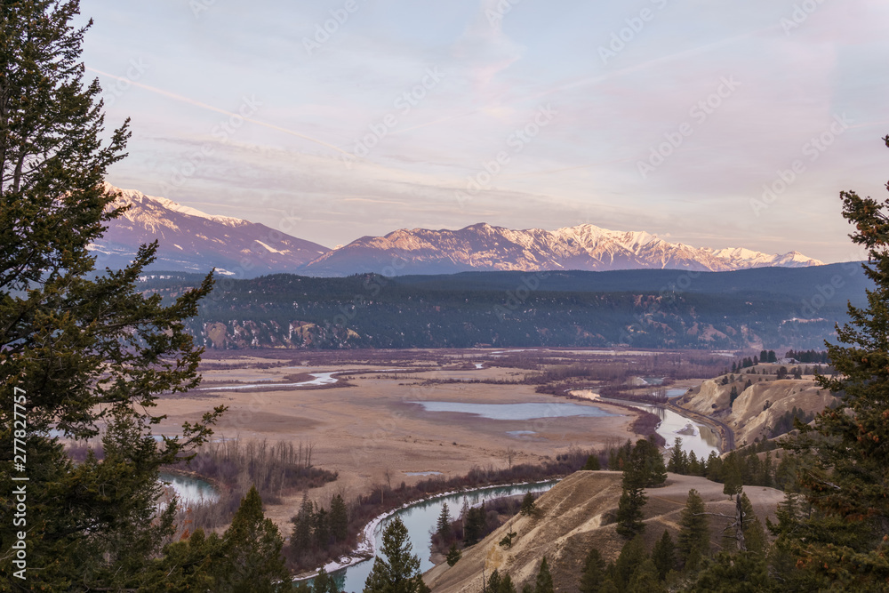 early spring morning at columbia river valleynear Radium Hot Springs with rocky mountains on the background.